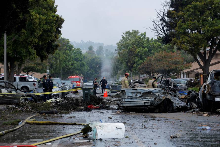 Crash scene after a civilian aircraft went down in a neighborhood, in San Diego