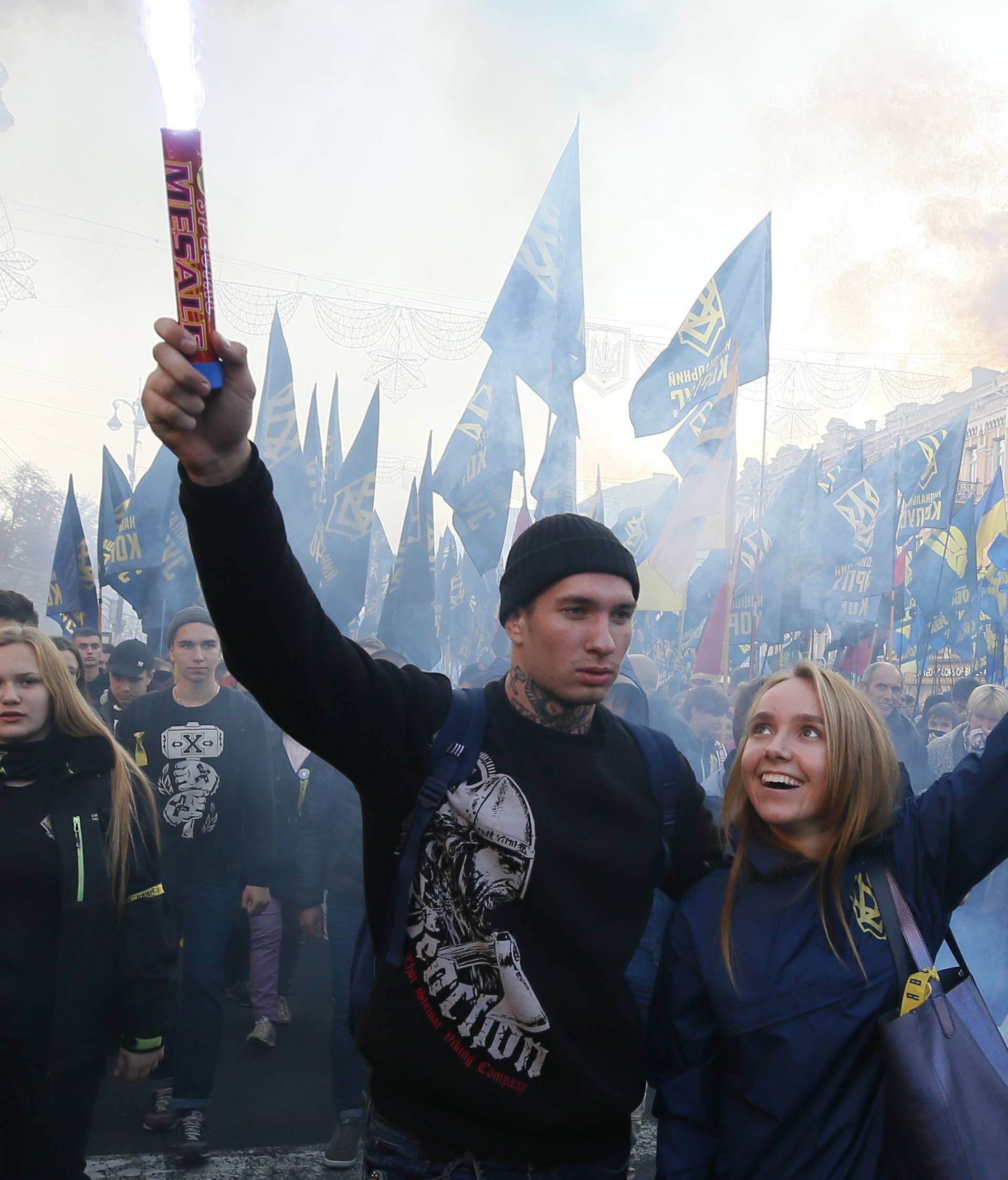 People take part in a procession to mark the Defender of Ukraine Day in Kiev