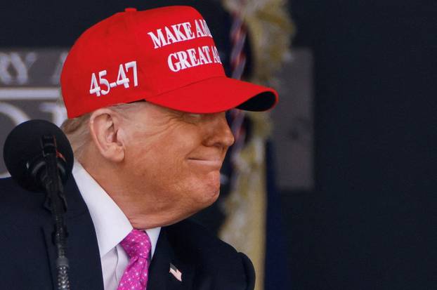 FILE PHOTO: U.S. President Donald Trump wears a 'Make America Great Again' (MAGA) hat in West Point, New York