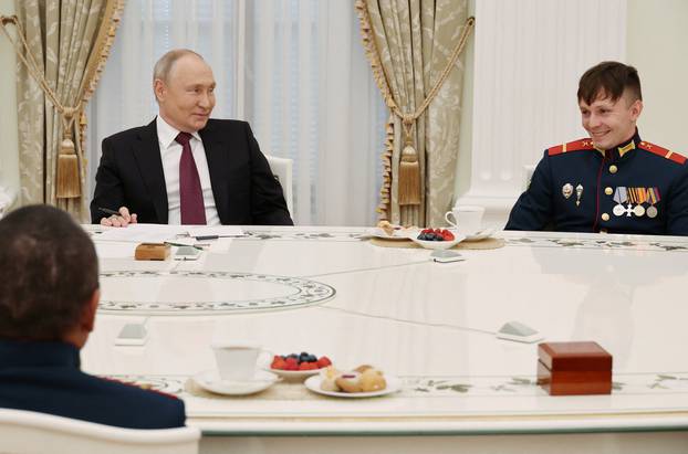 Russian President Putin meets with tank crew in Moscow