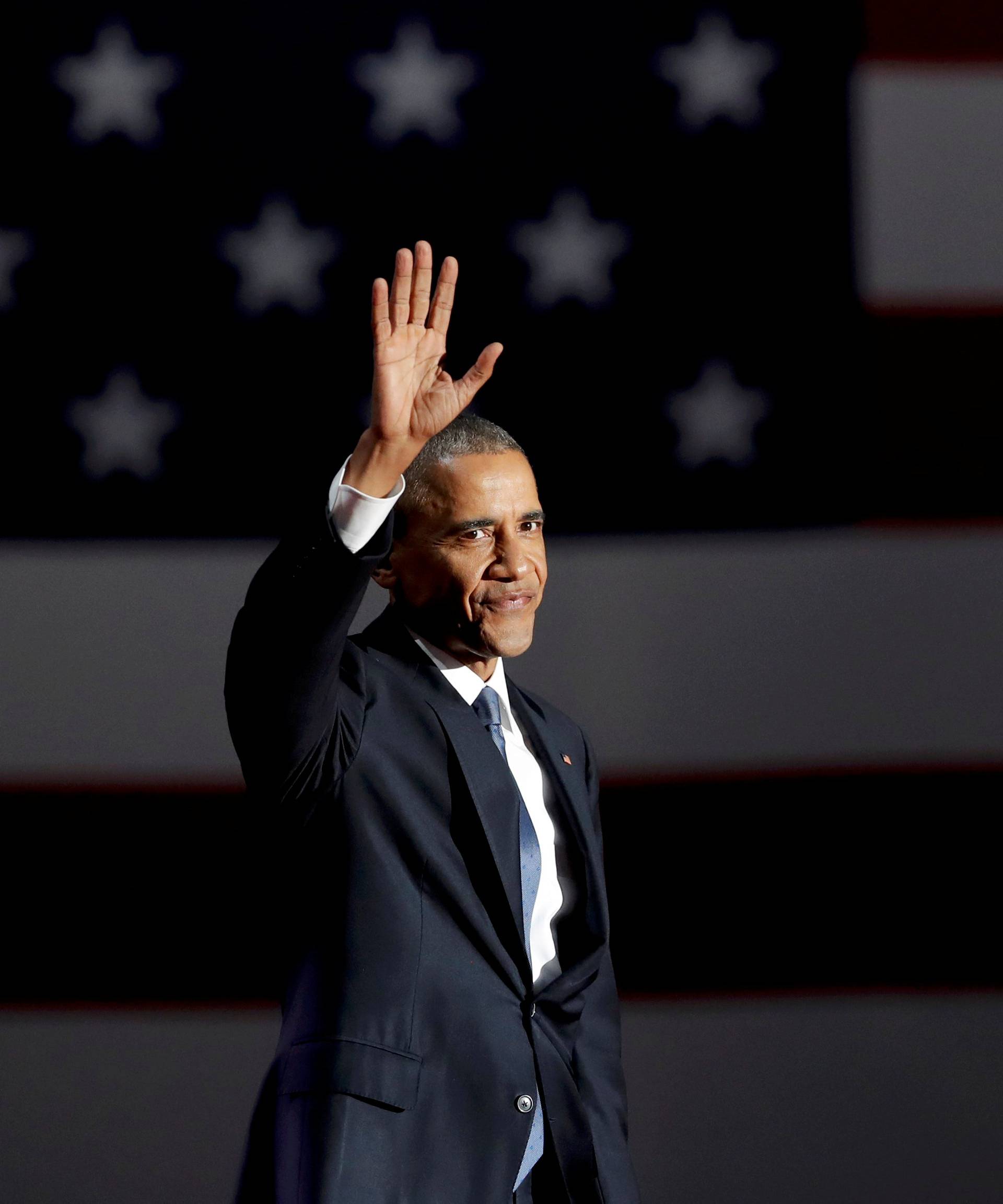 U.S. President Barack Obama acknowledges the crowd as he arrives to deliver his farewell address in Chicago