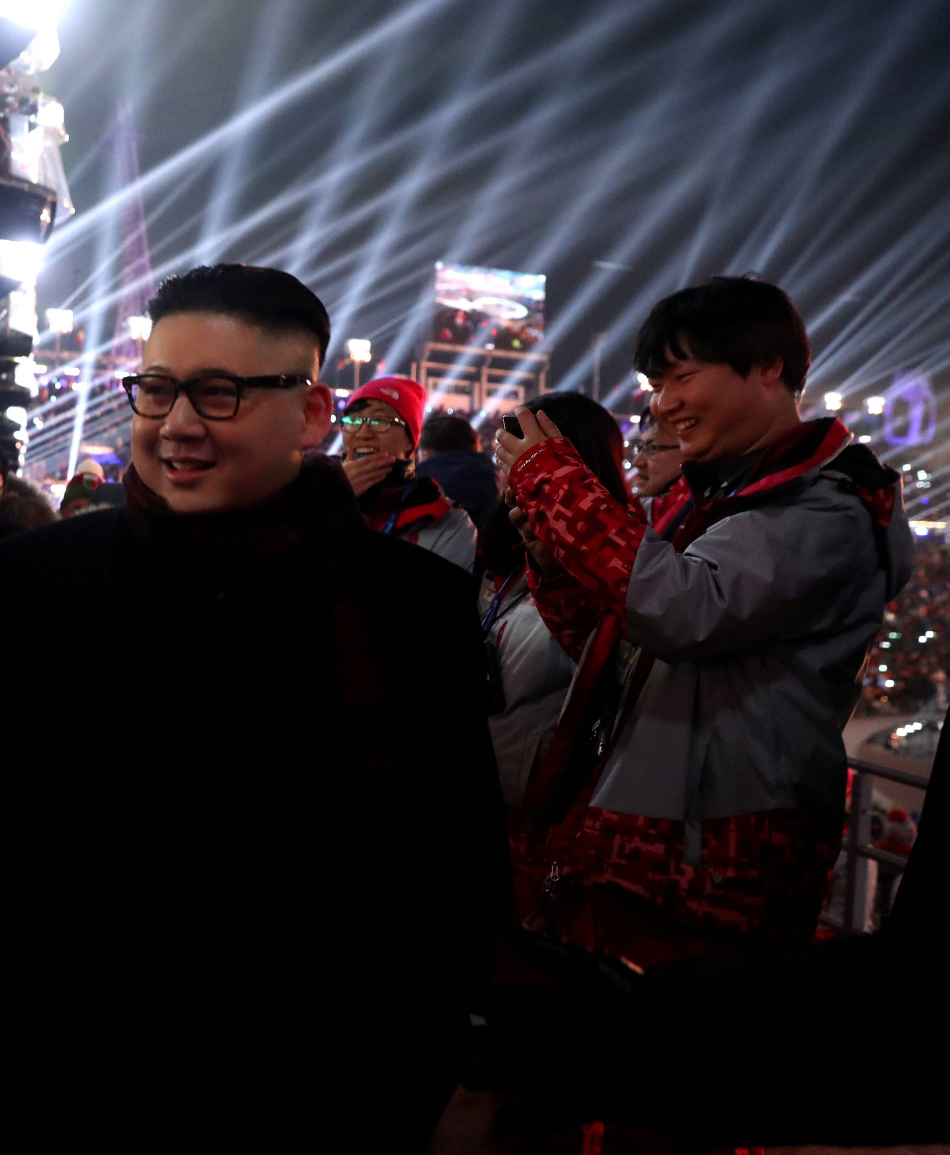 People dressed-up as U.S. President Donald Trump and North Korean leader Kim Jong Un attend the Winter Olympics opening ceremony in Pyeongchang