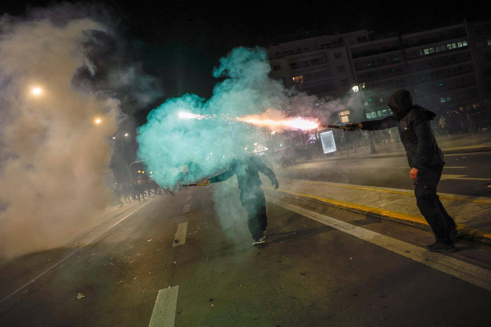 Protesters clash with police during a demonstration after a train crash near the city of Larissa, in Athens