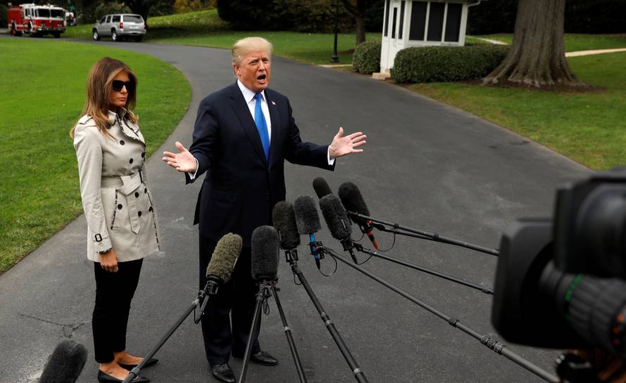 Trump speaks to reporters as he leaves the White House in Washington