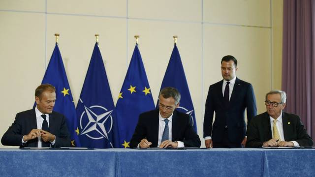 European Council President  Tusk, NATO Secretary-General Stoltenberg and European Commission President Juncker take part in a signing ceremony of EU-NATO Joint Declaration in Warsaw