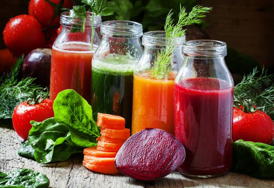Four kind of vegetable juices: red, burgundy, orange, green