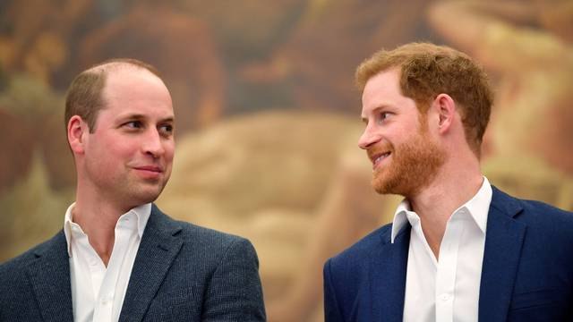 FILE PHOTO: Britain's Prince William and Prince Harry attend the opening of the Greenhouse Sports Centre in central London