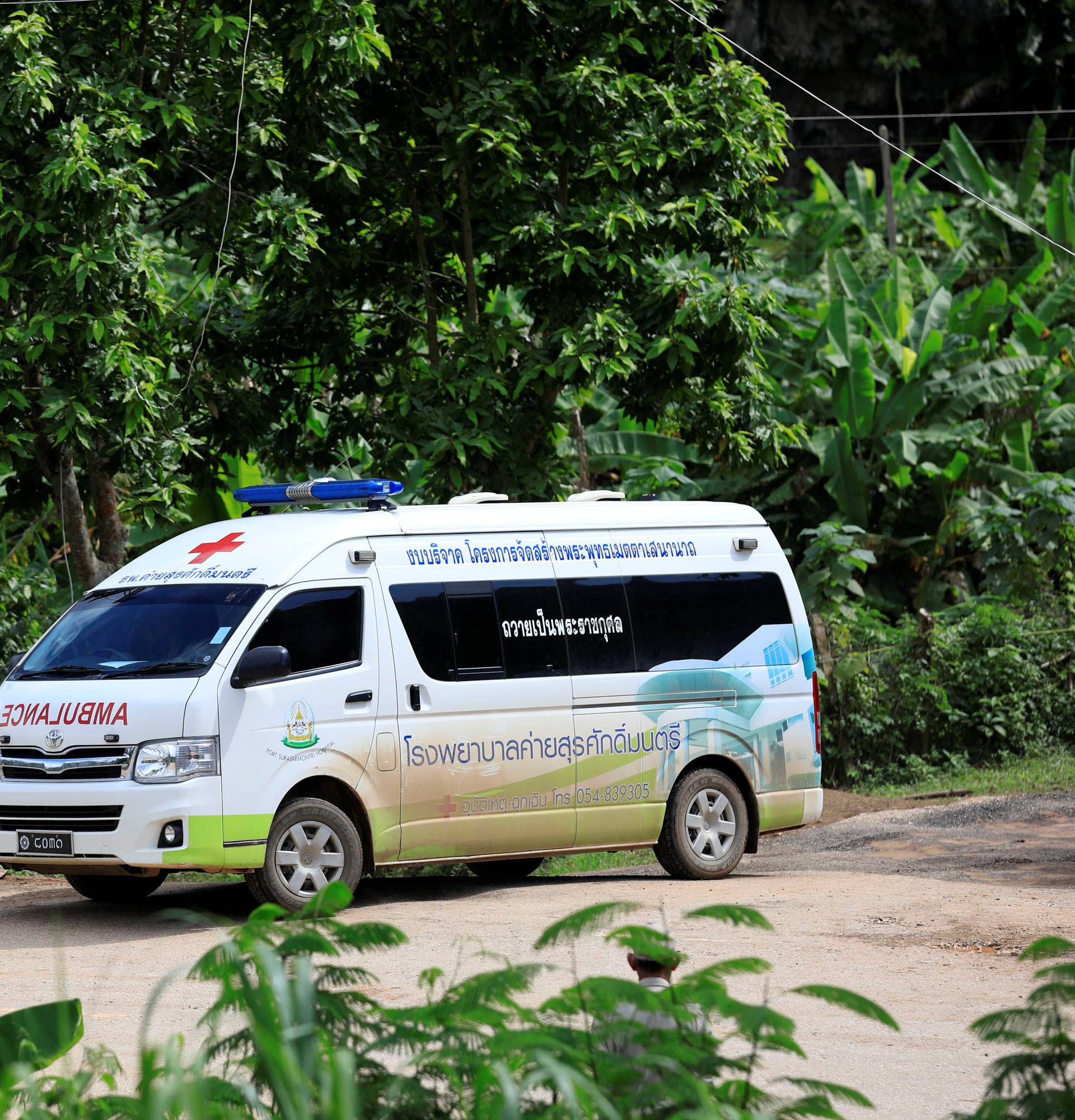 An ambulance leaves from Tham Luang cave complex  in the northern province of Chiang Rai