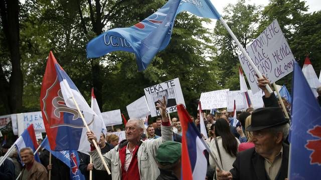 People march during an anti-government protest in Banja Luka