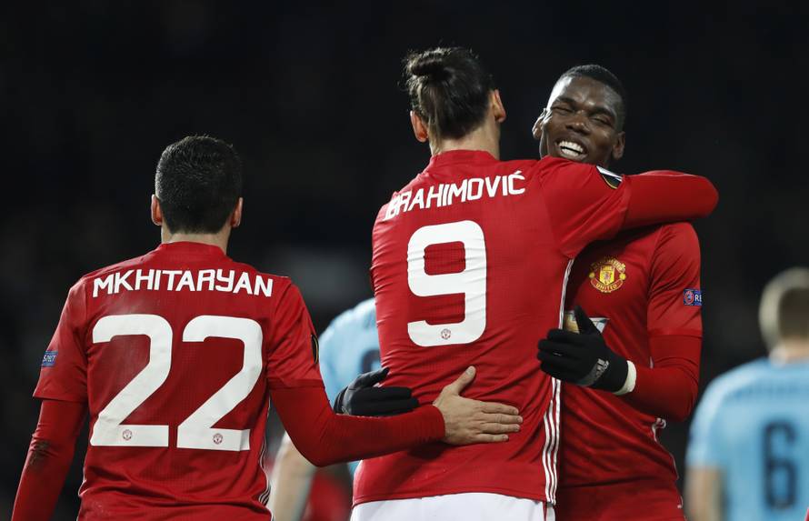 Manchester United's Zlatan Ibrahimovic celebrates with  Henrikh Mkhitaryan and Paul Pogba after Feyenoord's Brad Jones scores an own goal and the third for Manchester United