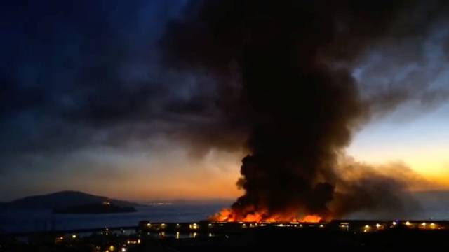 A view shows a four-alarm warehouse fire on Pier 45 in San Francisco