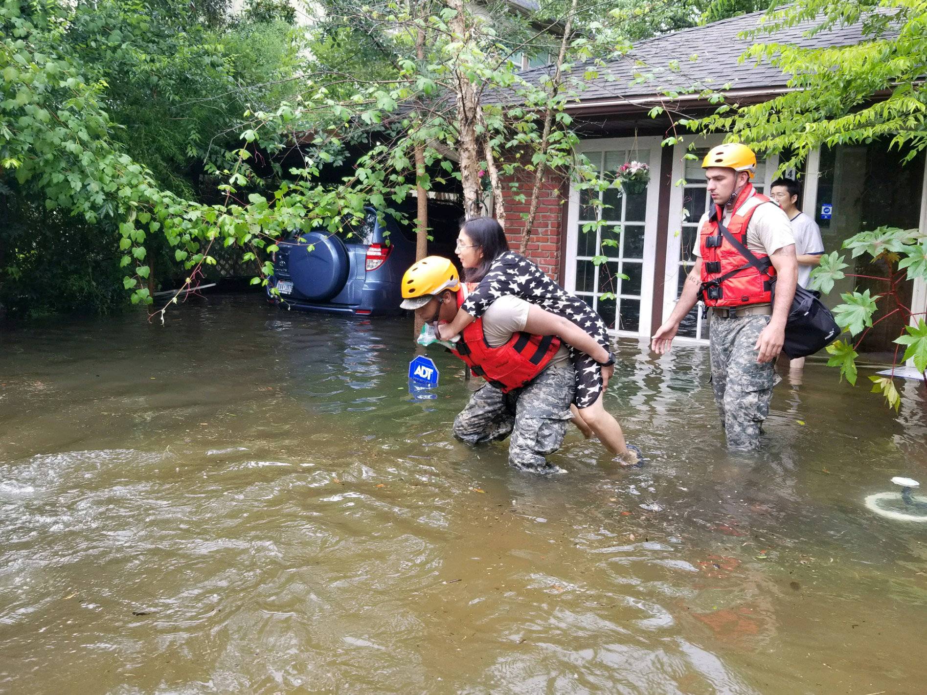 Handout photo of Texas National Guard soldiers aiding stranded residents in heavily flooded areas from the storms of Hurricane Harvey in Houston