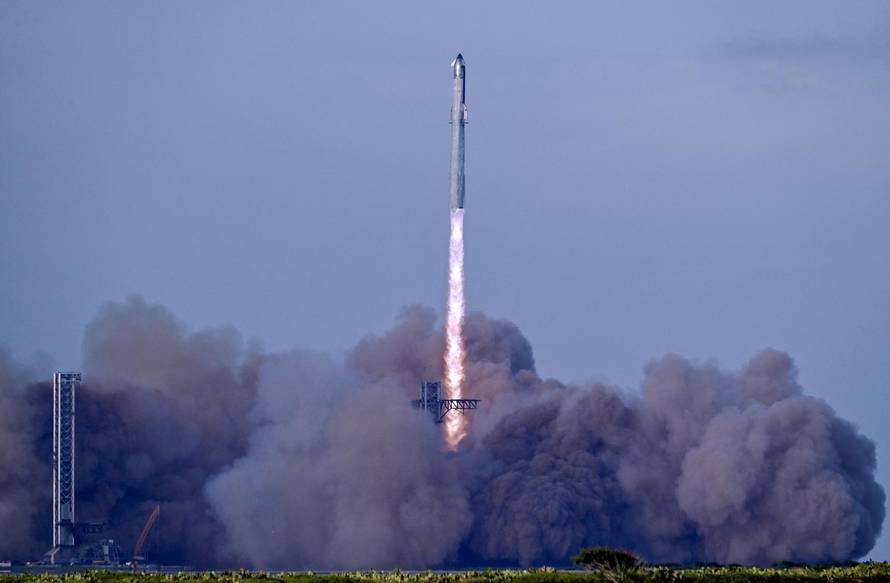 A SpaceX Super Heavy booster carrying the Starship spacecraft lifts off on its 10th test flight