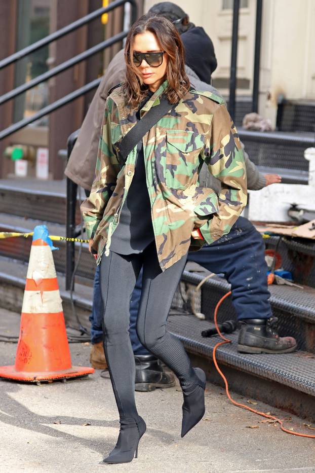 Victoria Beckham steps out wearing a camouflage military jacket and black tights, NYC