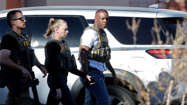 Law enforcement officers head into UNLV campus after reports of an active shooter in Las Vegas