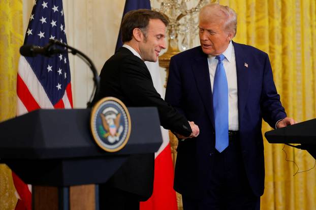 U.S. President Donald Trump and French President Emmanuel Macron attend a press conference at the White House in Washington