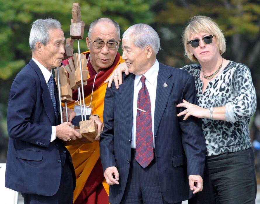 FILE PHOTO: Nobel Peace Prize laureates acknowledge atomic bomb survivors during an award presentation in Hiroshima