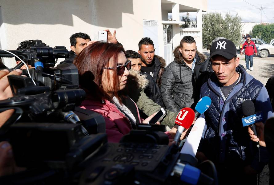 Walid, brother of suspect Anis Amri who is sought in relation with the truck attack on a Christmas market in Berlin, speaks to members of the media near their home in Oueslatia, Tunisia