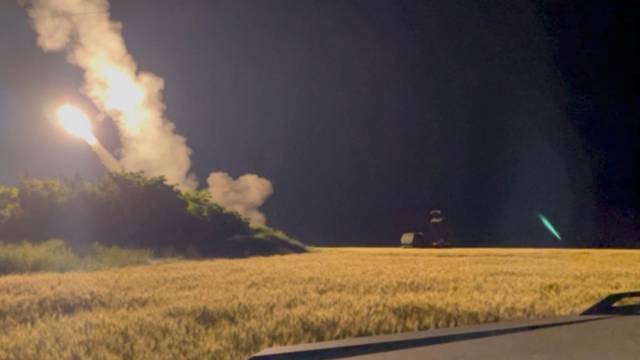 A view shows a M142 High Mobility Artillery Rocket System (HIMARS) is being fired in an undisclosed location