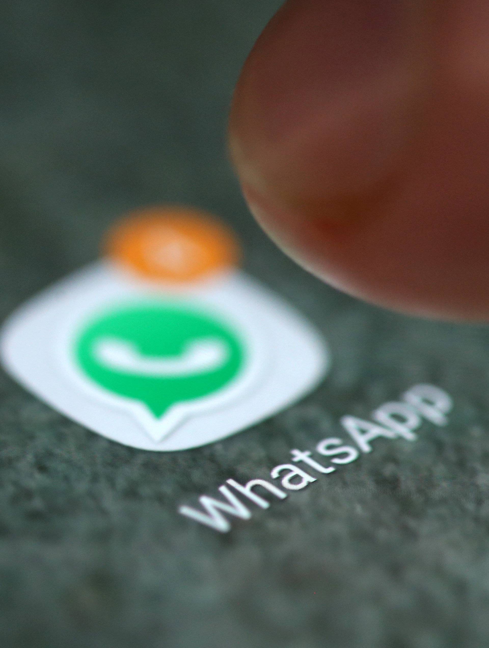 FILE PHOTO: The WhatsApp app logo is seen on a smartphone in this illustration