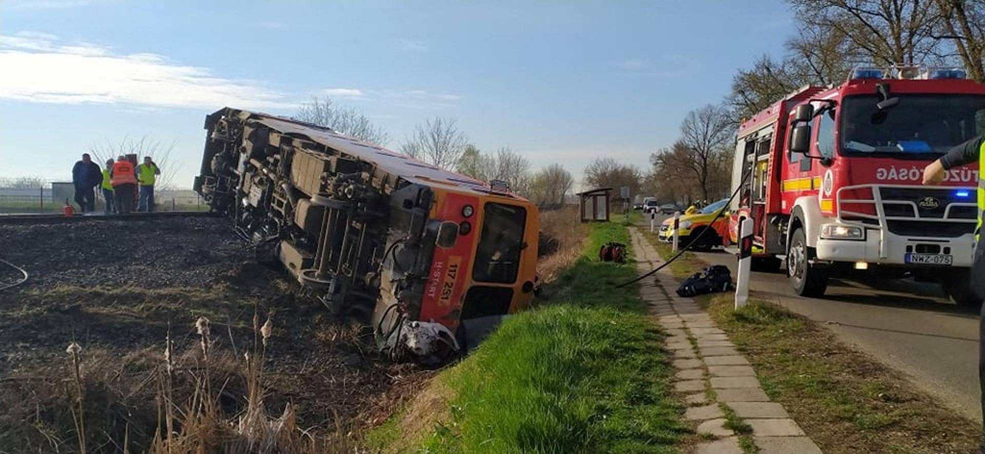 A derailed train is seen at a scene of an accident where a pick-up truck crashed into a train in Mindszent