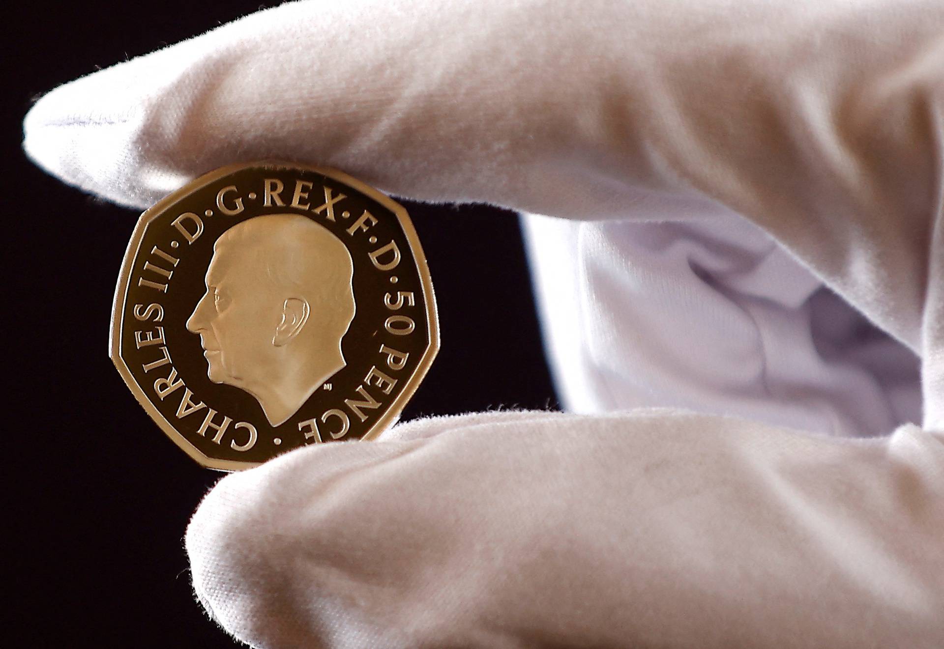 The official coin effigy of Britain’s King Charles III is seen on a 50 pence coin, unveiled by The Royal Mint, in London