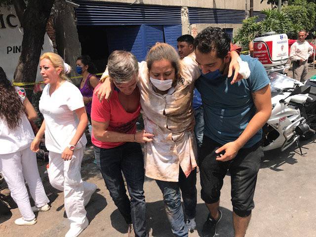 People are seen injured after an earthquake hit in Mexico City