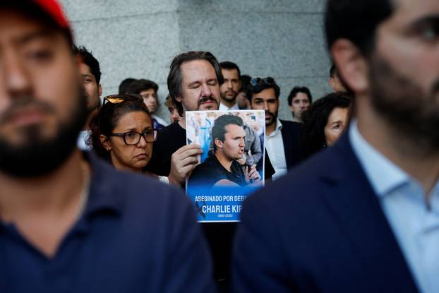People mourn Charlie Kirk outside the U.S. embassy in Madrid