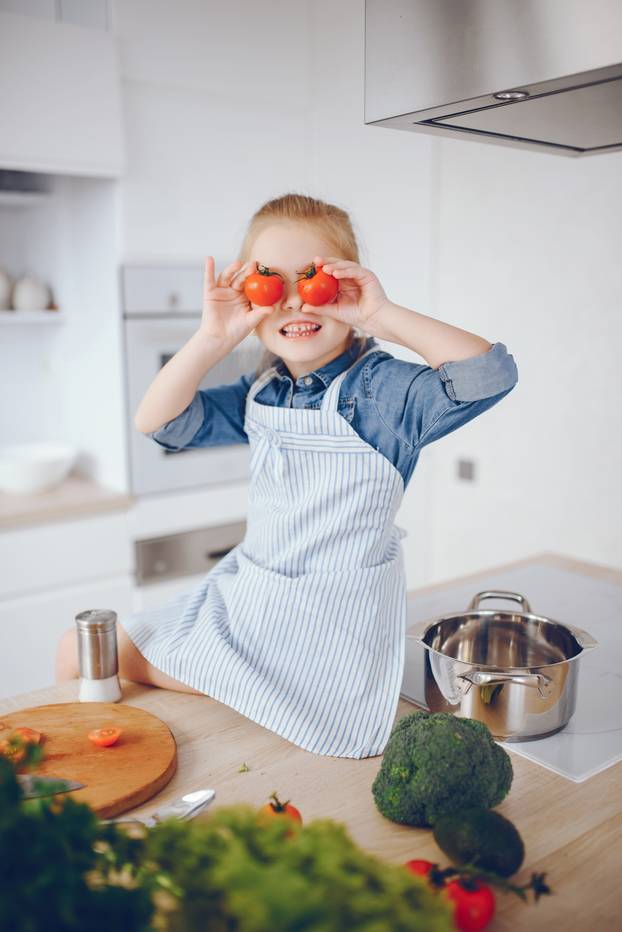 little girl in a kitchen