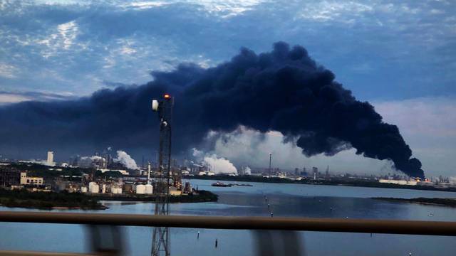 Handout photo of smoke rising from a fire burning at the Intercontinental Terminals Company in Deer Park, east of Houston