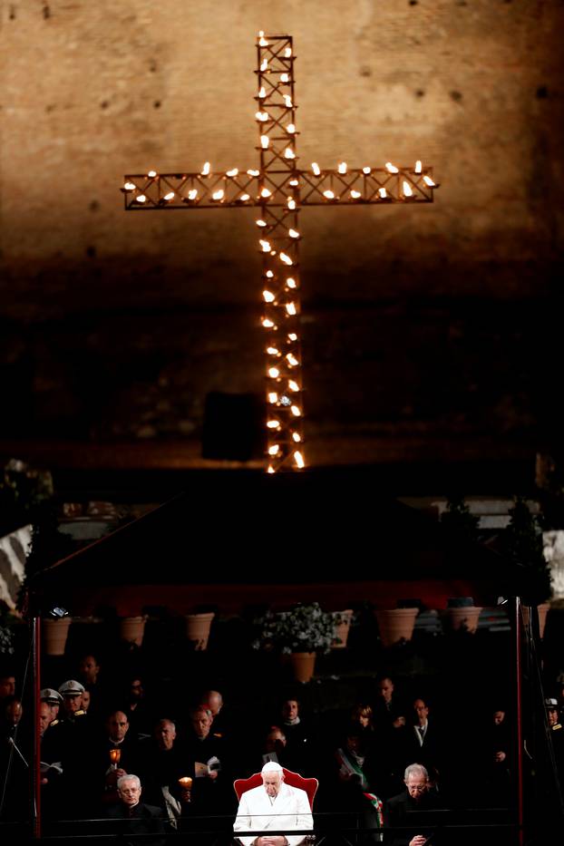 Pope Francis leads the Via Crucis (Way of the Cross) procession during Good Friday celebrations at the Colosseum in Rome