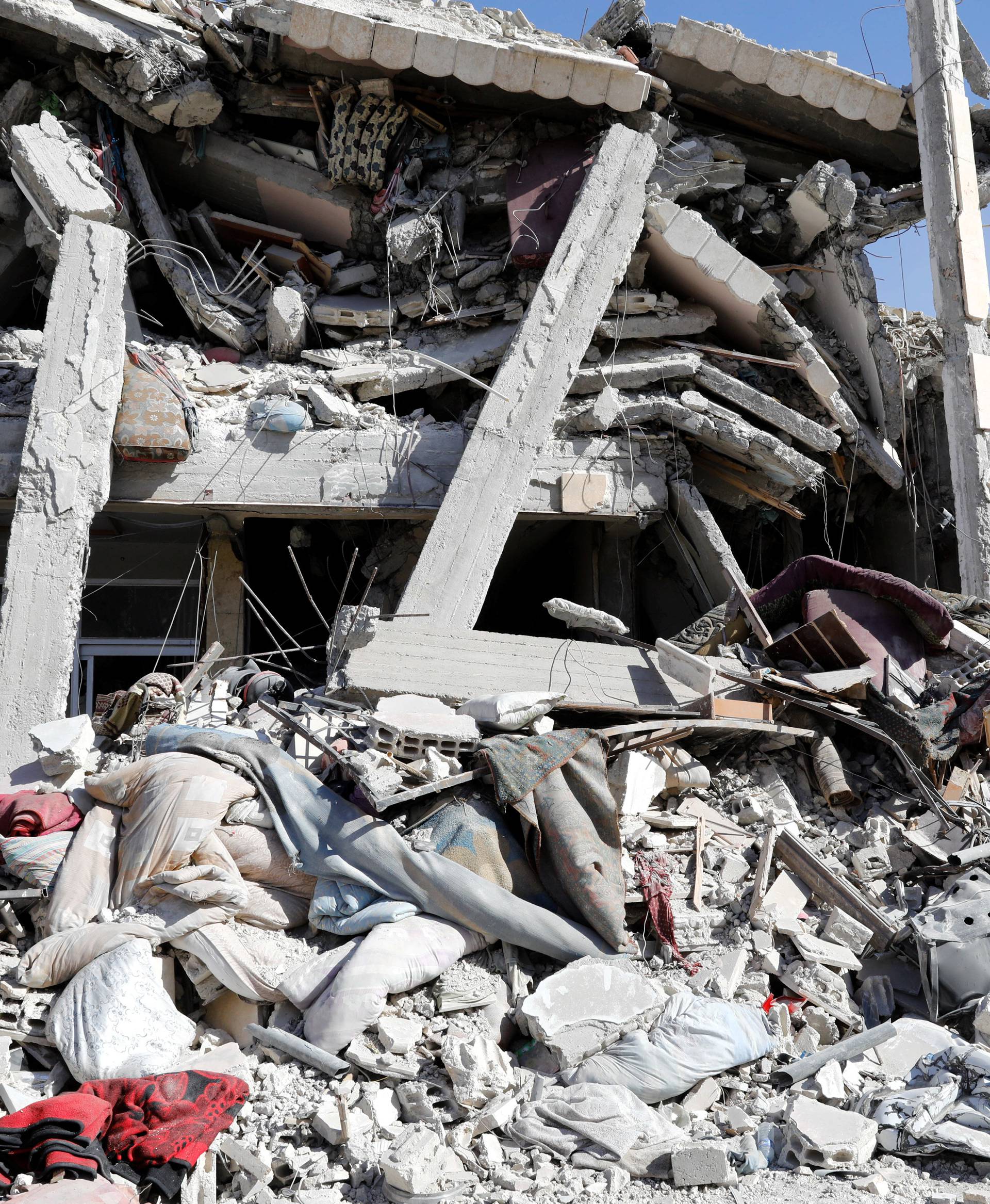 General view of a collapsed building due to fighting in Raqqa's old city in Syria