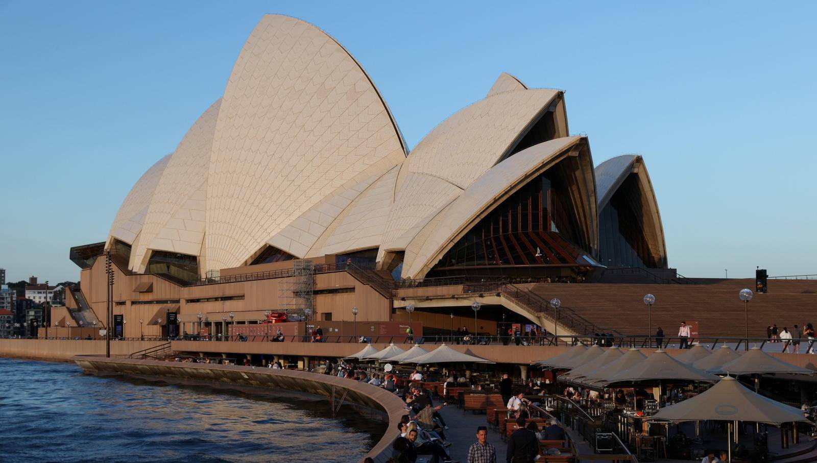 Diners enjoy the harbour waterfront by the Sydney Opera House in Sydney