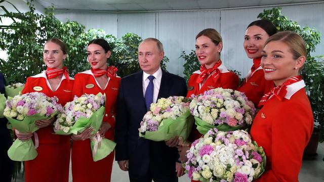 Russian President Putin visits an aviation school in Moscow