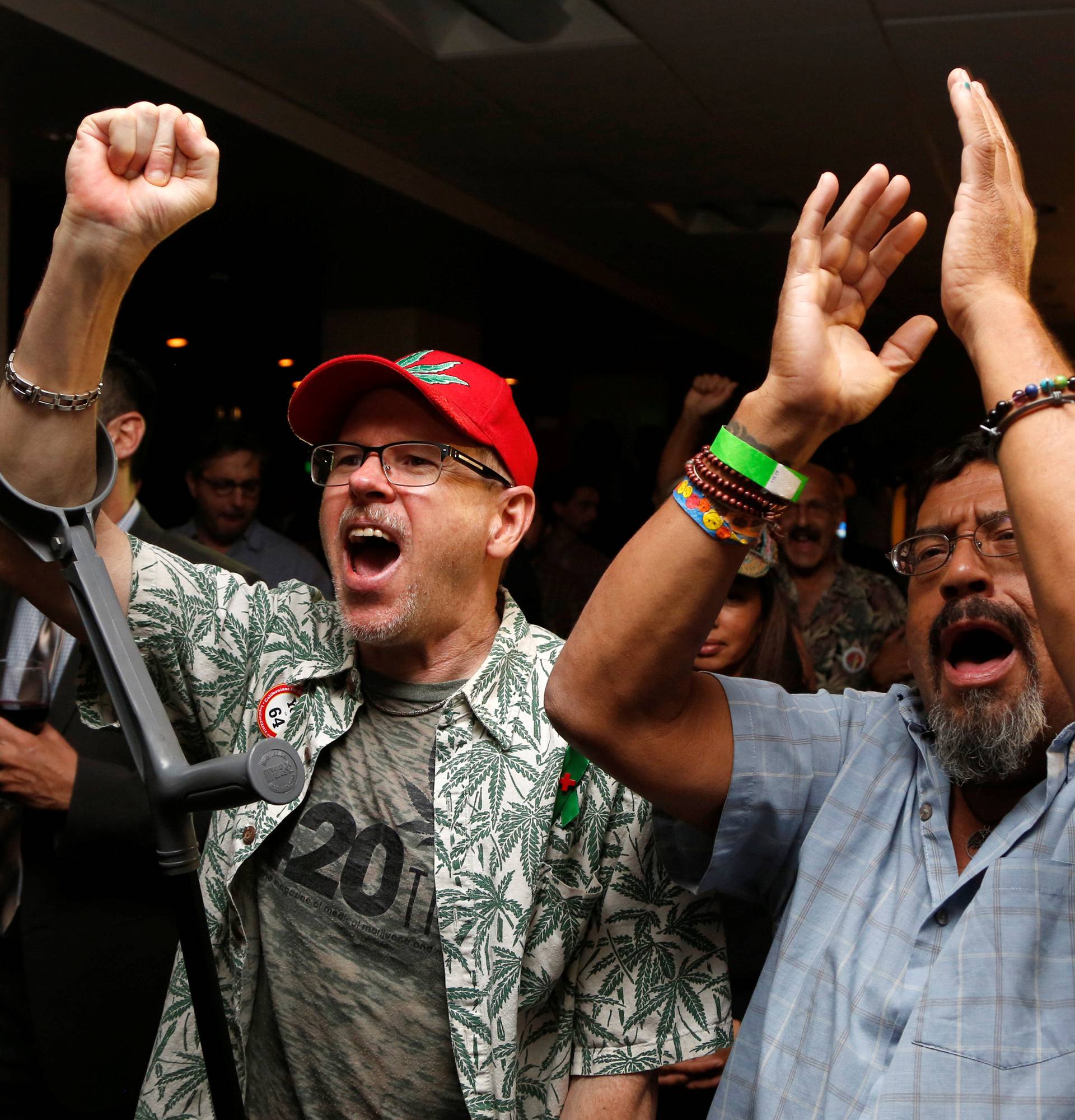 Britt and Moreno celebrate after Californians voted to pass Prop 64, legalizing recreational use of marijuana in the state, in Los Angeles, California