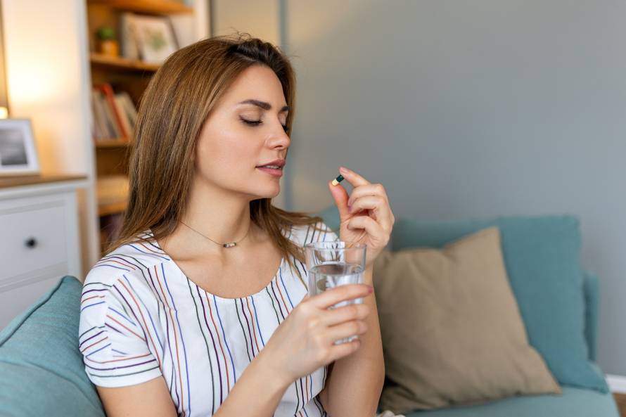 Woman,Takes,Medicines,With,Glass,Of,Water.,Daily,Norm,Of