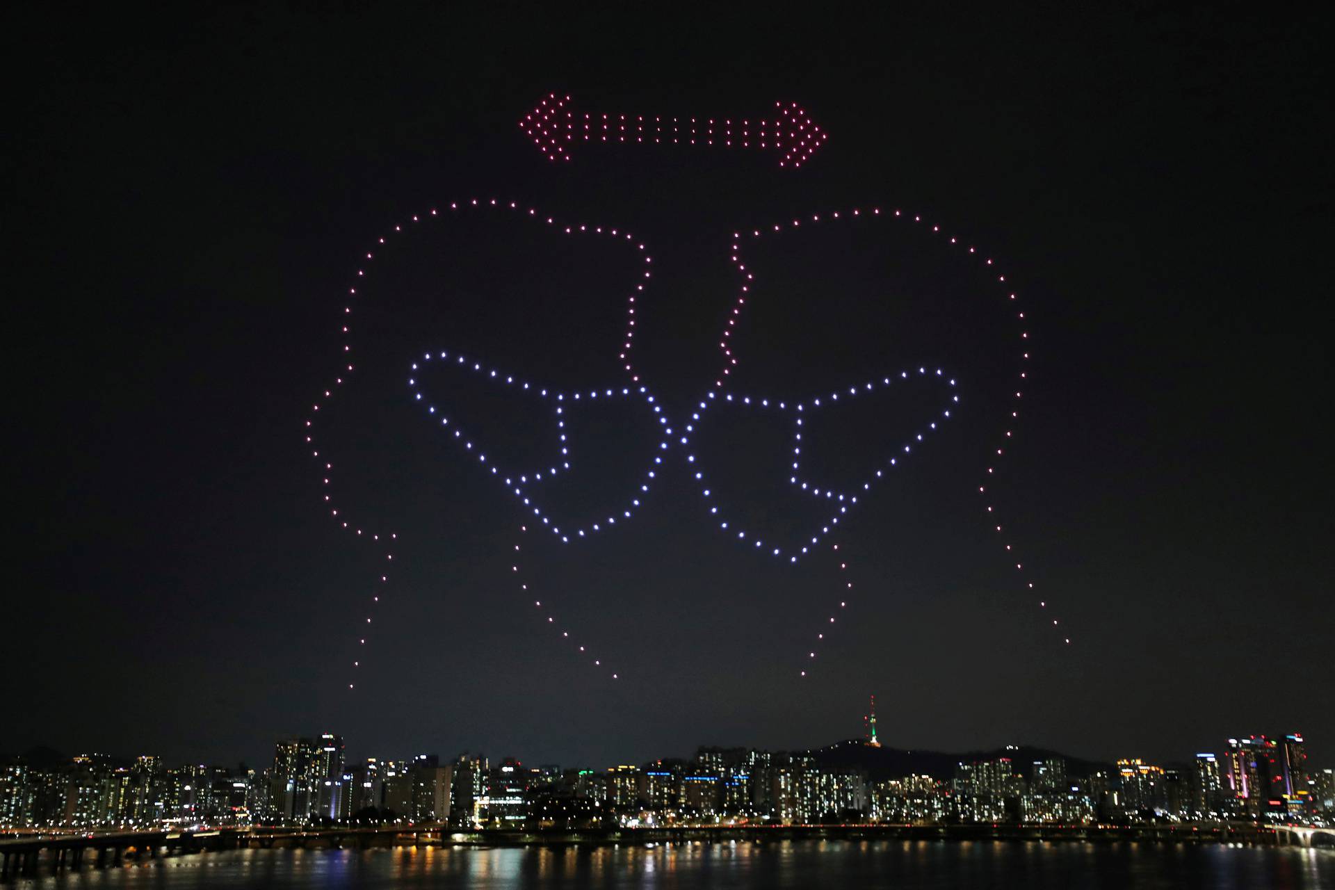 Drones fly over the Han river showing messages to support the country, as measures to avoid the spread of the coronavirus disease (COVID-19) continue, in Seoul