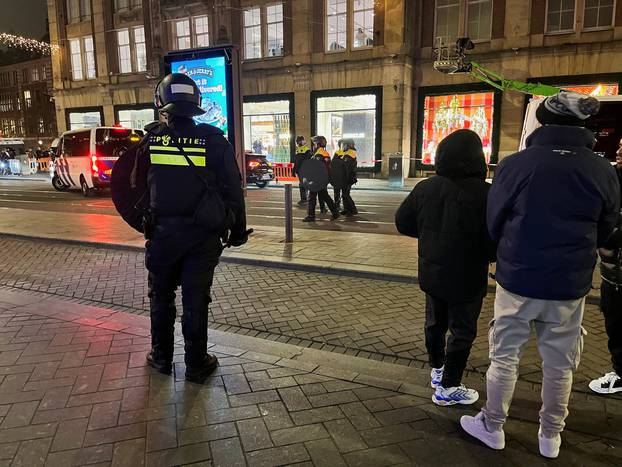 Israeli football supporters are guarded by police after violence targeting Israeli football fans broke out in Amsterdam overnight, in Amsterdam