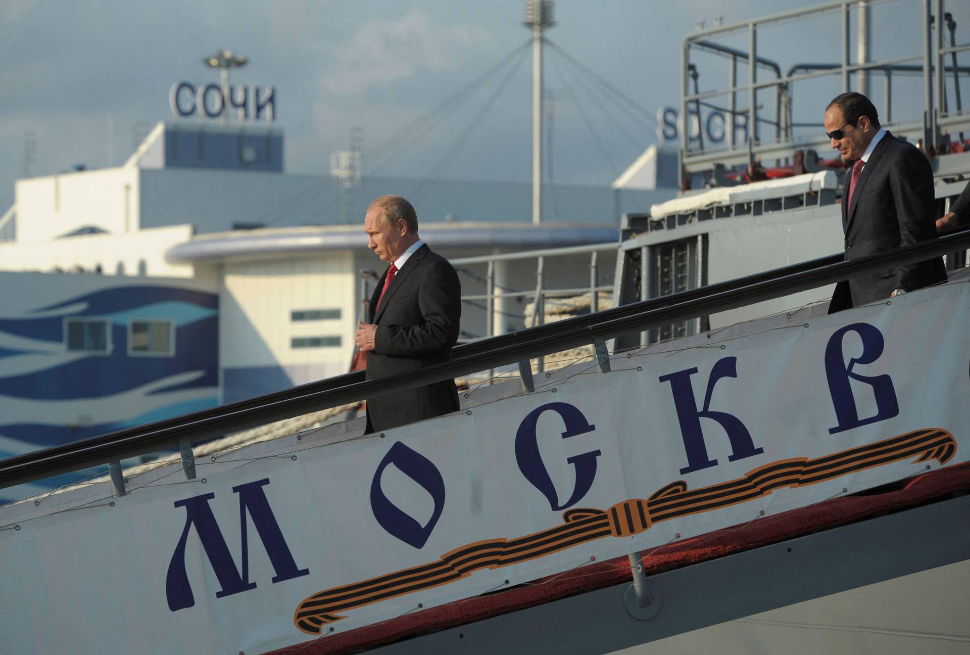 FILE PHOTO: Russia's President Putin and his Egyptian counterpart Sisi leave the guided missile cruiser Moskva in Sochi