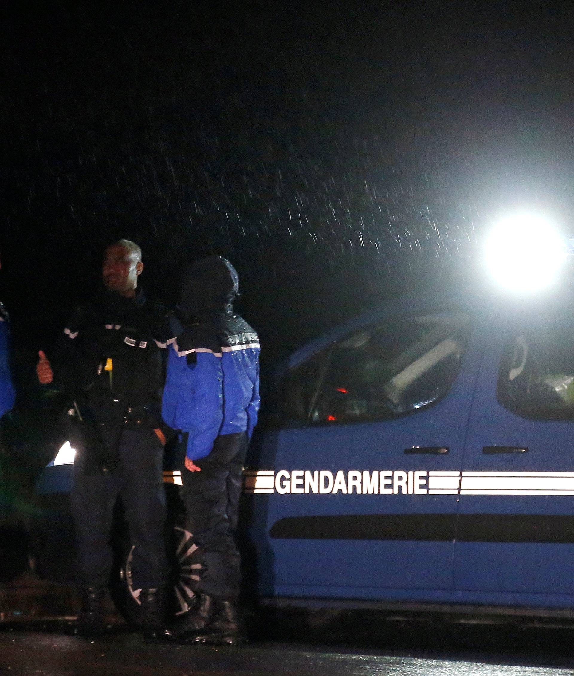 French gendarmes stand guard near a retirement home in Montferrier-sur-Lez, near Montpellier