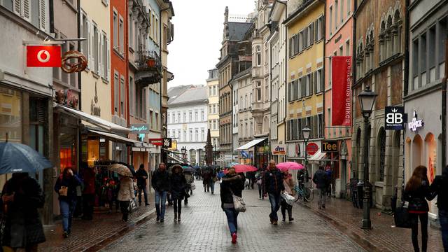 FILE PHOTO: People walk on a shopping street in the southern German town of Konstanz