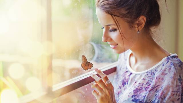 Beautiful woman with butterfly