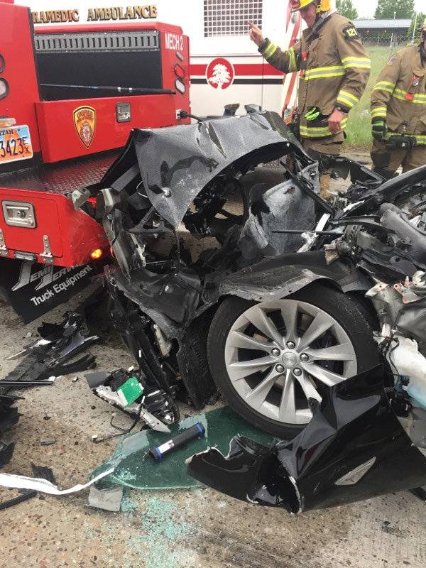 A Tesla Model S is seen after it hit the back of a mechanic truck  in South Jordan,