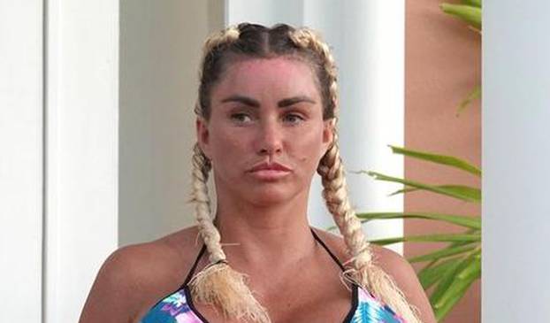 *EXCLUSIVE* WEB MUST CALL FOR PRICING  - Wearing her furry blue slippers and showing off the results of her biggest EVER boob job in her sexy multicoloured bikini, the British Glamour Model Katie Price is pictured enjoying her holiday in Thailand.*PICTUR