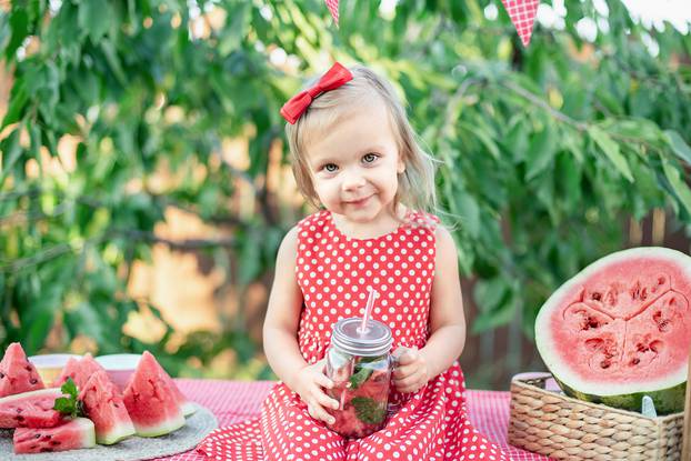 Watermelon lemonade with ice and mint as summer refreshing drink in jars.