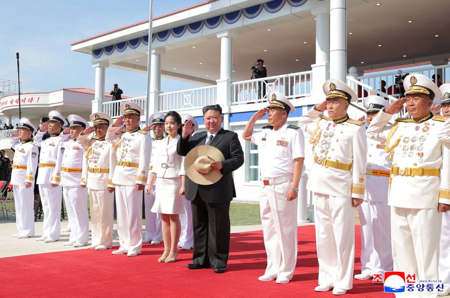North Korean leader Kim Jong Un attends the launching ceremony of a warship that had been damaged upon its first attempt to launch