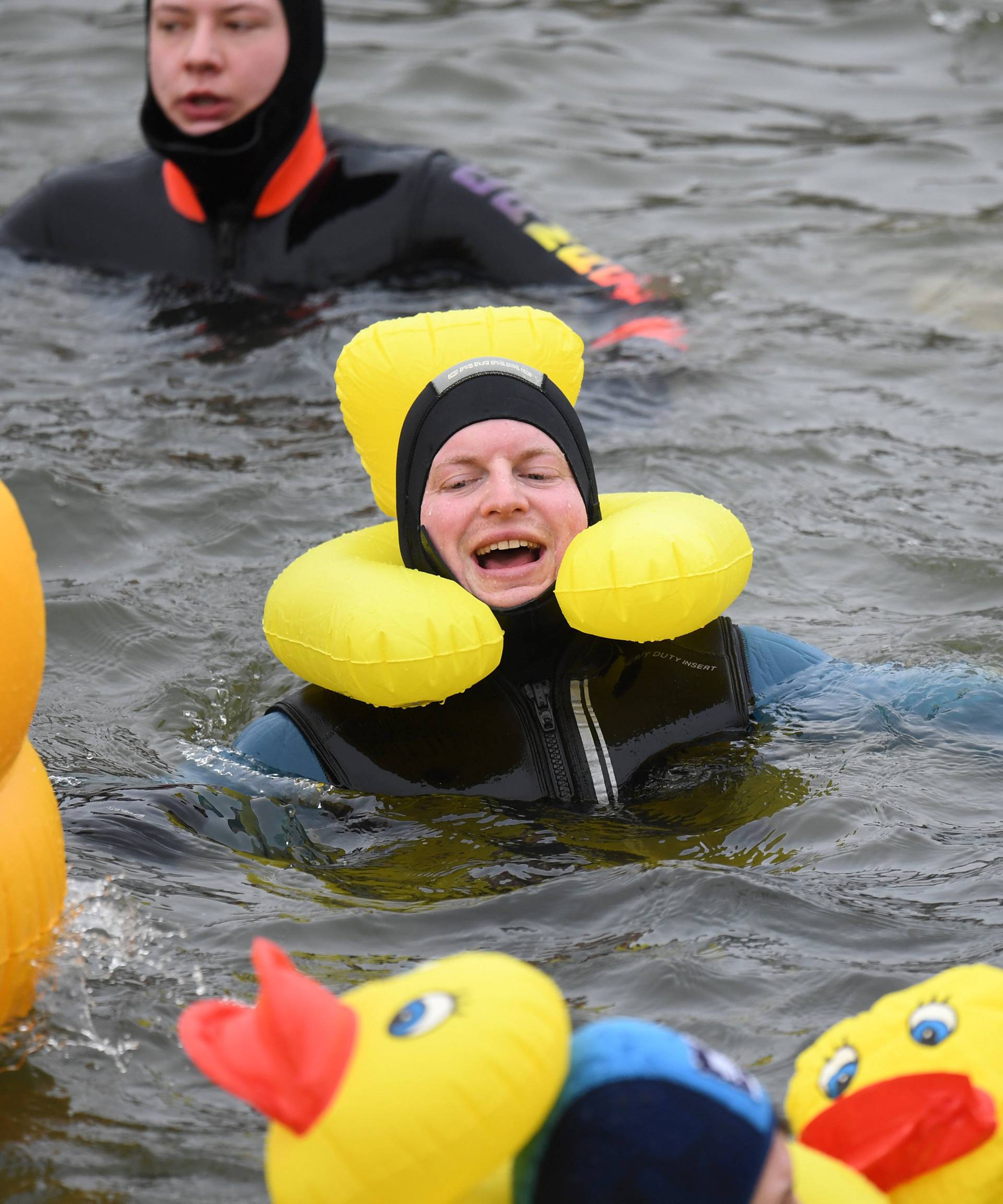 Swimmers wearing costumes bathe in the 3 degrees Celsius water of the river Danube during their annual 4 km swim, in Neuburg an der Donau