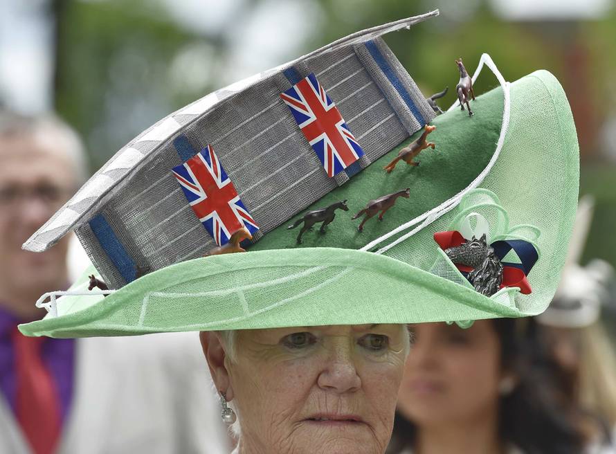 Britain Horse Racing Ladies Day Racegoer wears hat