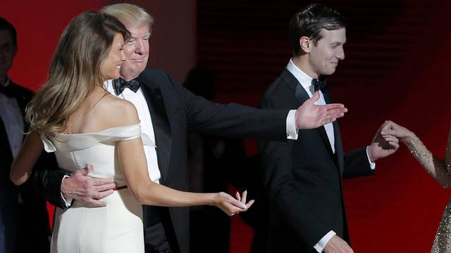 U.S. President Donald Trump and his wife first lady Melania Trump gesture towards his daughter Ivanka and her husband Jared Kushner at his "Liberty" Inaugural Ball in Washington