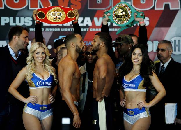 James DeGale and Badou Jack pose during the weigh in with Floyd Mayweather